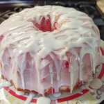 Strawberry Cream Cheese Pound Cake 6 Moist strawberry cream cheese pound cake topped with pink glaze and fresh strawberries