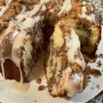 Sock It to Me Pound Cake: The Southern Classic That Steals the Show 6 Freshly baked sock it to me pound cake with cinnamon swirl and glaze, served on a white cake stand.