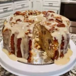 Pineapple Pecan Cream Cheese Pound Cake: A Southern Classic You’ll Bake Again and Again 6 Slice of pineapple pecan cream cheese pound cake with glaze and chopped pecans on top