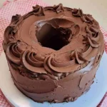 Super Moist Chocolate Pound Cake Recipe | Rich, Fudgy & Easy to Make 6 Moist chocolate pound cake slice with rich chocolate frosting on a white plate